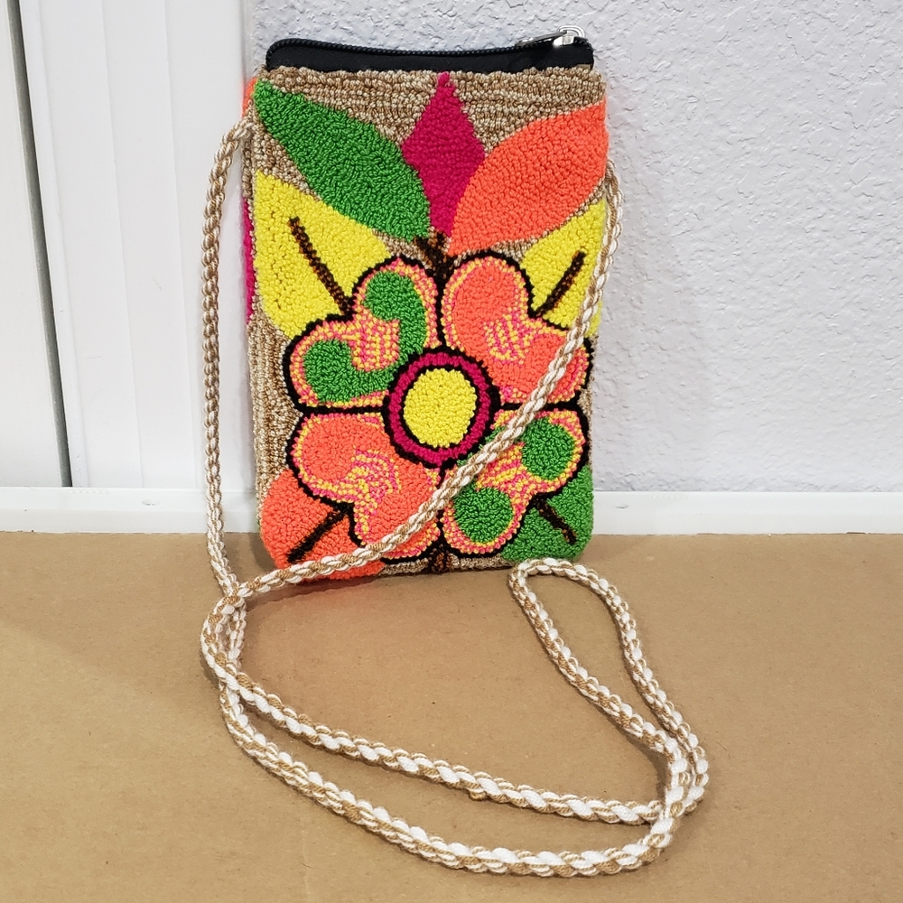 Handmade Wayuu Lined Mochila Cell phone bag with a floral design